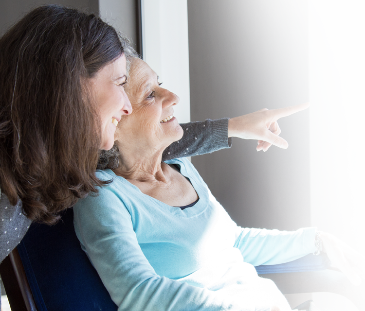 A Dove Court care team member spending time with a resident